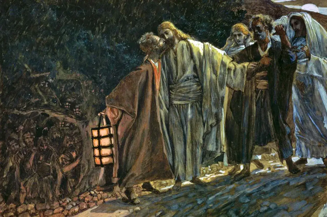 Judasz całuje Jezusa, zdradzając go. W tle widać uzbrojonych ludzi z latarniami.